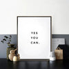 A framed canvas art print featuring the motivational quote Yes you can in black text on a white background.