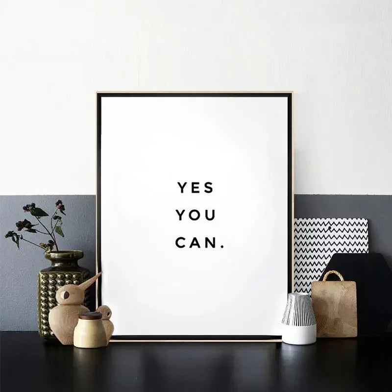 A framed canvas art print featuring the motivational quote Yes you can in black text on a white background.