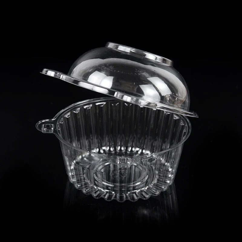 Clear plastic cupcake boxes with lids displayed against a black background.