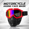 A red motorcycle riding face mask with tinted goggles is displayed on a white surface.