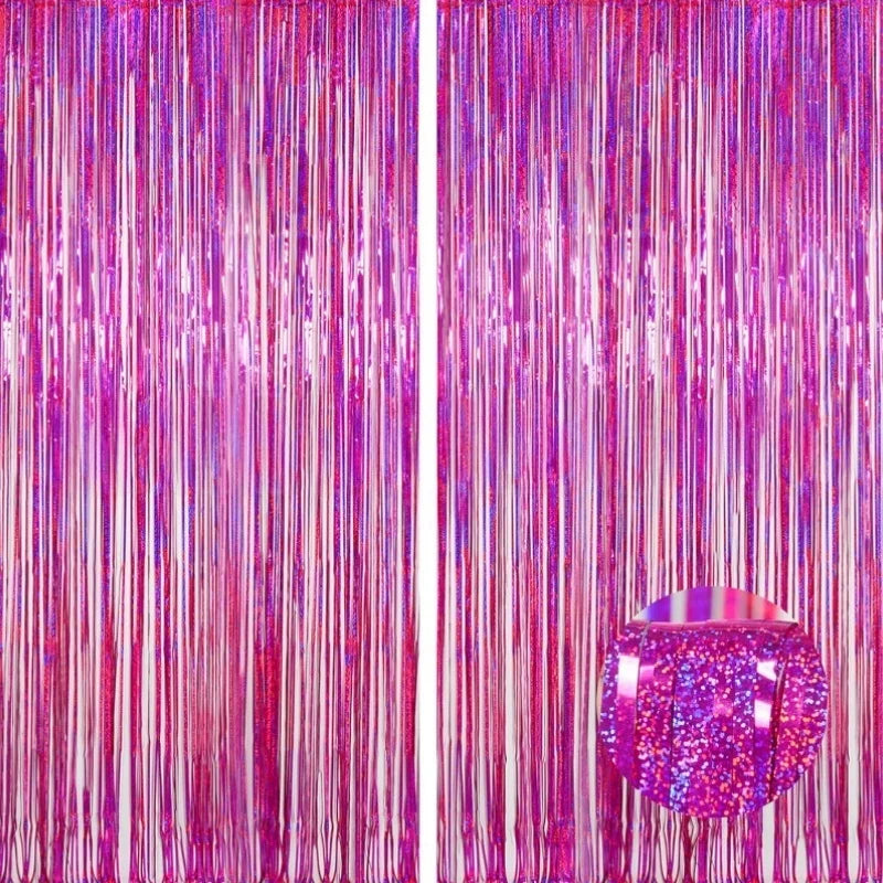 A vertical backdrop featuring shimmering pink and purple metallic foil tinsel fringe curtains.
