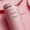 A pink waterproof name sticker bottle labeled Aaron with dimensions provided.