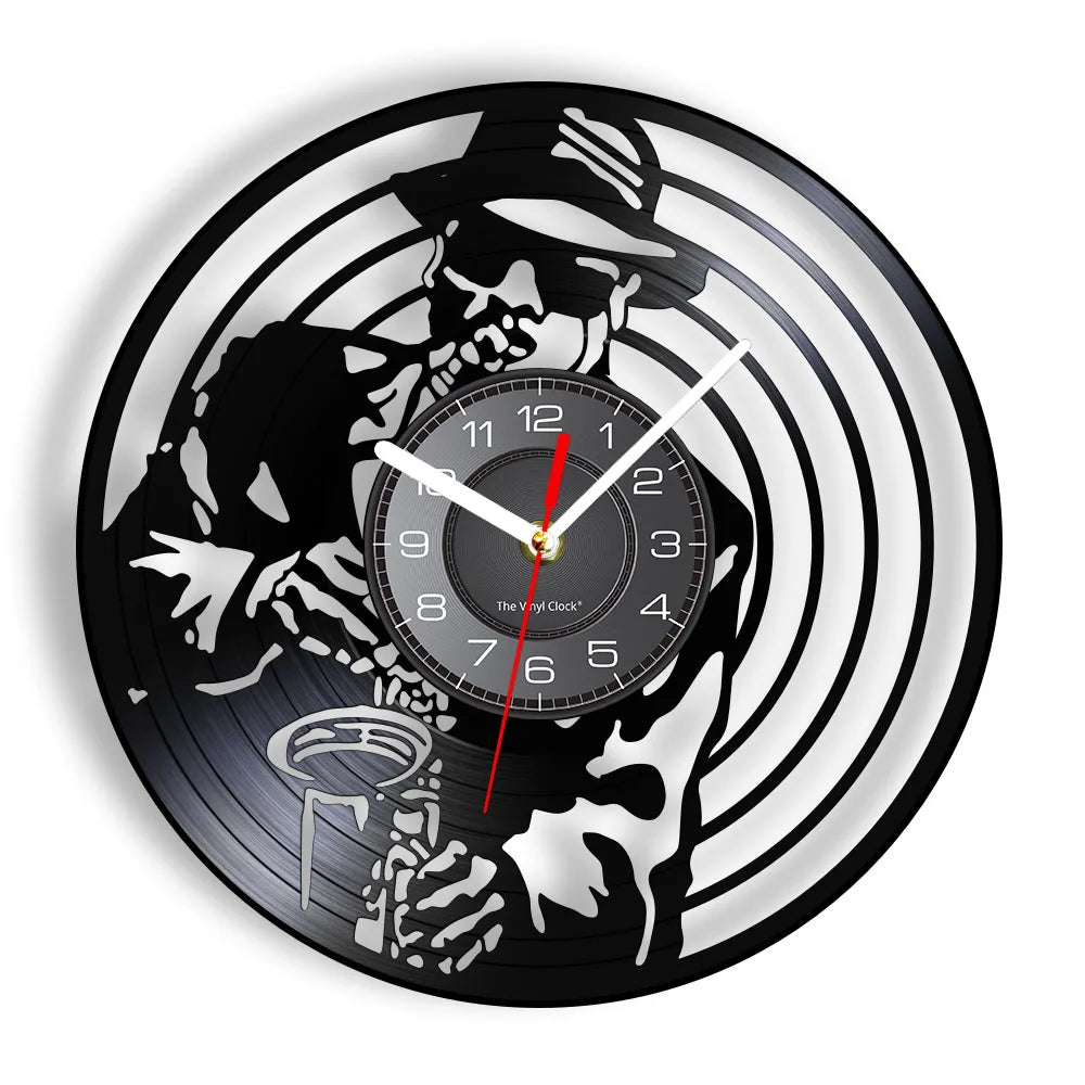 A black wall clock face featuring a stylized silhouette of a person and a vinyl record design.