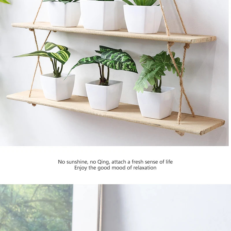 A set of six white potted artificial flower bonsai plants displayed on a wooden shelf with twine hangers.