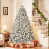 A flocked artificial Christmas tree decorated with warm white LED lights standing in a bright room.