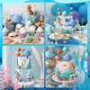A set of ocean animals cake toppers and pearl balls for a sea-themed party display.