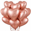 A bouquet of ten rose gold heart-shaped foil balloons for celebrations.