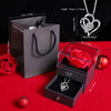 A gift set featuring a preserved red rose and a heart-shaped silver necklace displayed in a dark box.
