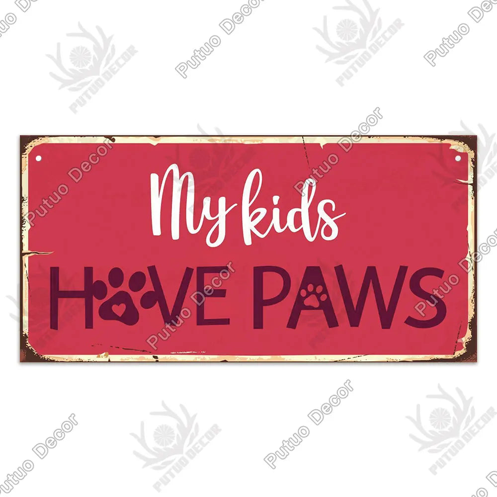 Rustic wooden wall plaque sign with white text reading My kids HAVE PAWS on a red background