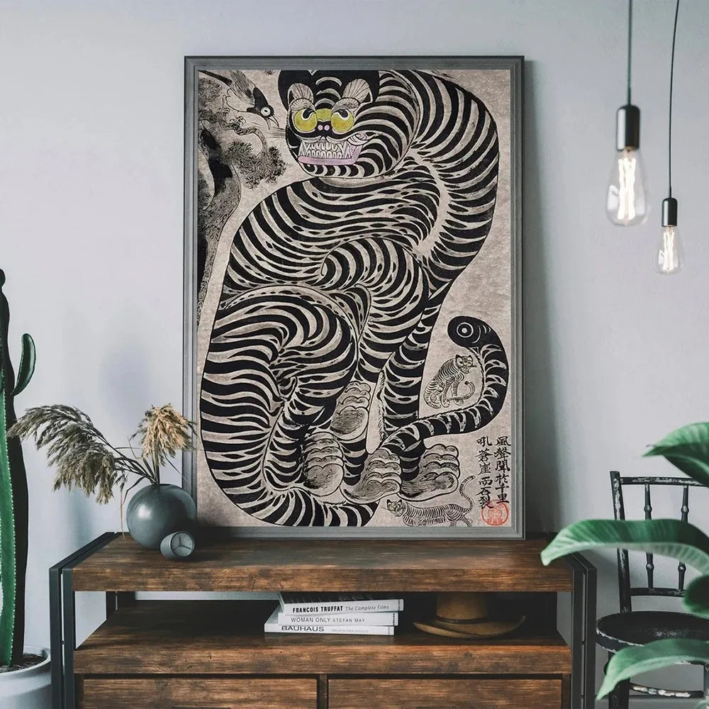 A framed canvas print featuring a black and white striped tiger cat design on a gray wall.