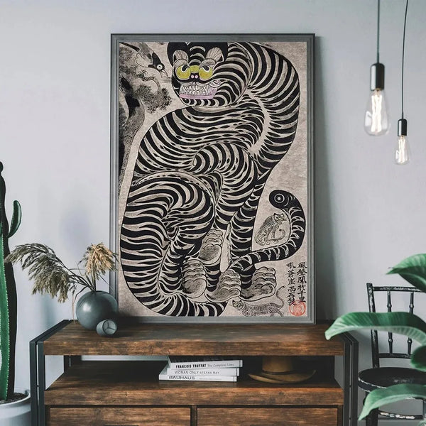 A framed canvas print featuring a black and white striped tiger cat design on a gray wall.