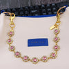 Gold and pink rhinestone chain extender attached to a bag strap