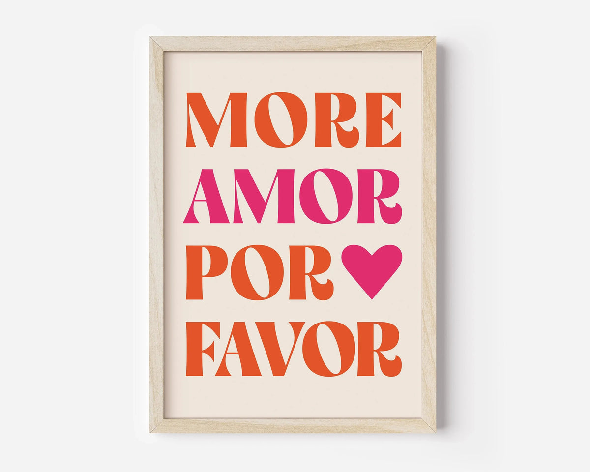 Framed canvas wall art with the text MORE AMOR POR FAVOR in orange and pink lettering on a cream background.