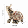 Golden Feng Shui elephant statue for wealth and good fortune, showing a detailed decorative figure.