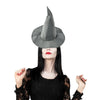 A woman wearing a gray witch hat and black lace top looking directly at the camera.