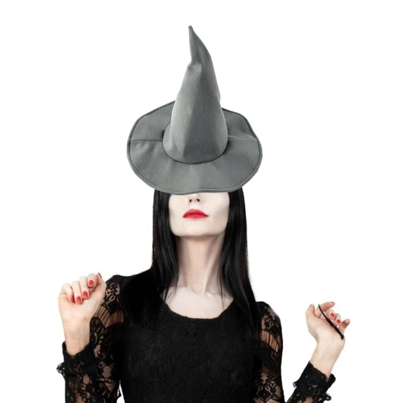 A woman wearing a gray witch hat and black lace top looking directly at the camera.