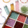 A collection of round glass spacer beads in various colors like pink, green, yellow, and purple are displayed in glass jars a