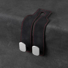 Black suede car headrest hooks designed for hanging bags and groceries