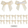 A set of five white satin ribbon bows with self-adhesive backing for crafting and gift wrapping.