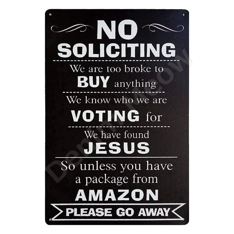 A black metal sign with white text humorously stating no soliciting and voting for Jesus, with a request to go away.
