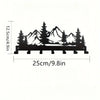 Black industrial iron wall mount key holder featuring seven hooks shaped like mountain peaks and evergreen trees.