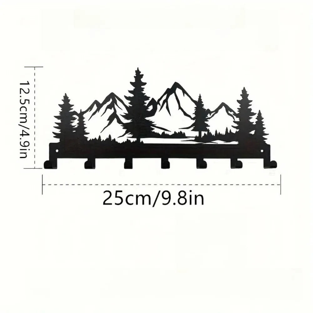 Black industrial iron wall mount key holder featuring seven hooks shaped like mountain peaks and evergreen trees.