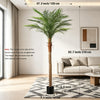 Artificial golden palm tree with long fronds displayed in a modern living room setting.
