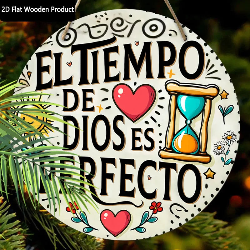 A white wooden plaque with a black inspirational quote in Spanish, surrounded by decorative elements and greenery.