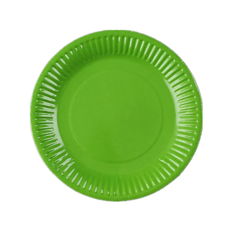 A round, lime green disposable plate with a ruffled edge.