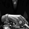 A hand wearing a diamond bracelet is resting on a black and white checkered surface with various glass objects.