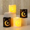 A collection of glowing LED lanterns featuring gold stars and crescent moons on white and black bases.