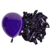 A purple latex balloon next to a pile of dark purple crinkled foil balloons.
