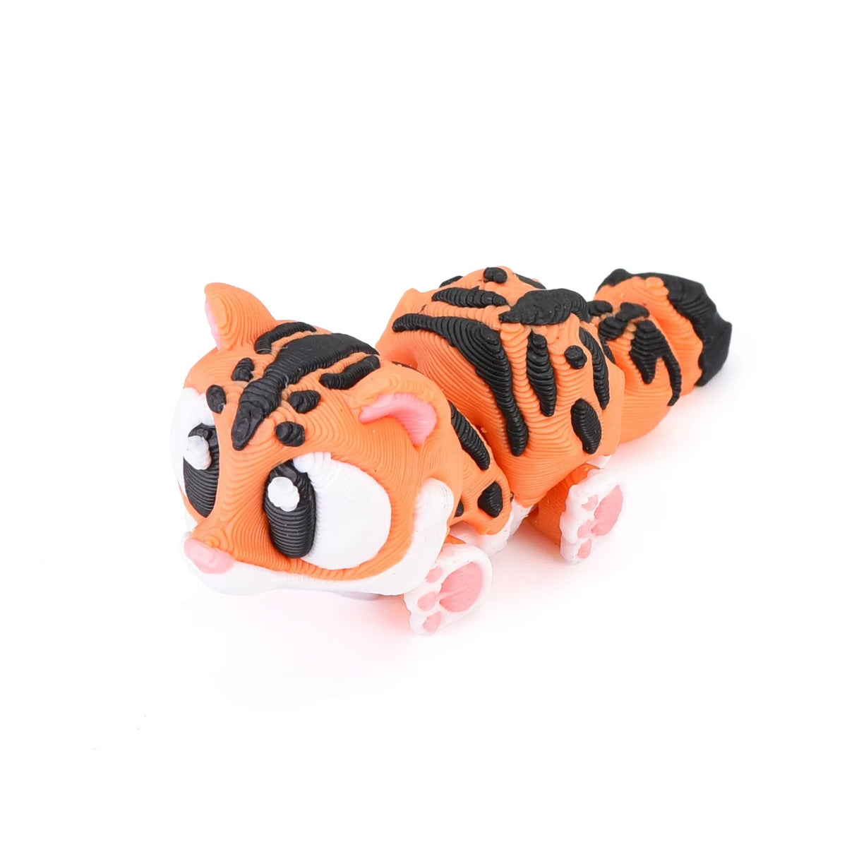 An orange and black tiger figurine with white accents, designed for desk decor.