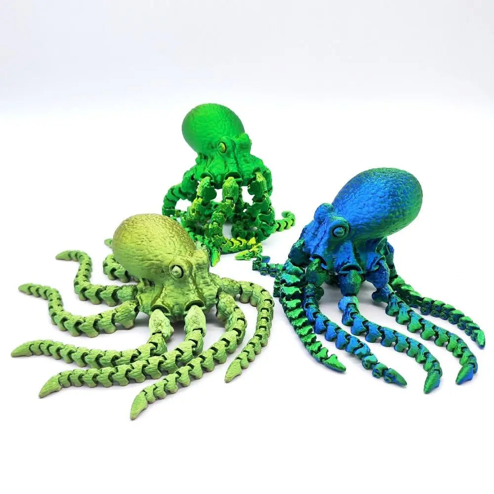 Three articulated 3D printed octopus figurines in shades of green and blue.