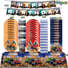 Monster truck birthday party decoration kit featuring backdrop, tableware, and vehicle props.