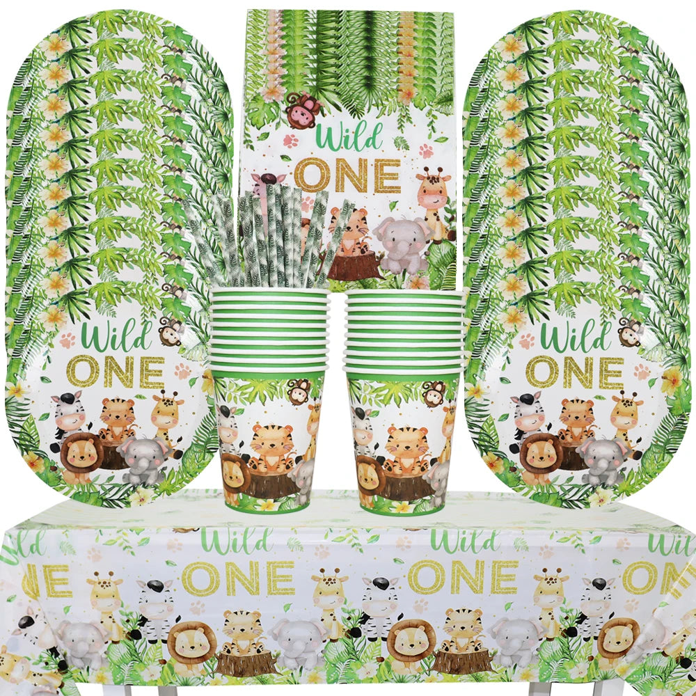 A set of green and white patterned tableware including plates, napkins, and cups for a Wild One safari jungle party.