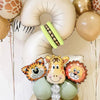 A set of jungle animal themed balloons including a giraffe balloon, tiger balloon, and a number balloon.