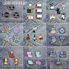 A collection of enamel pins featuring cartoon cats, flowers, and various designs on denim fabric.