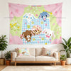 A pink and green tapestry featuring cute animal characters like a bunny and a dog on a light blue background.