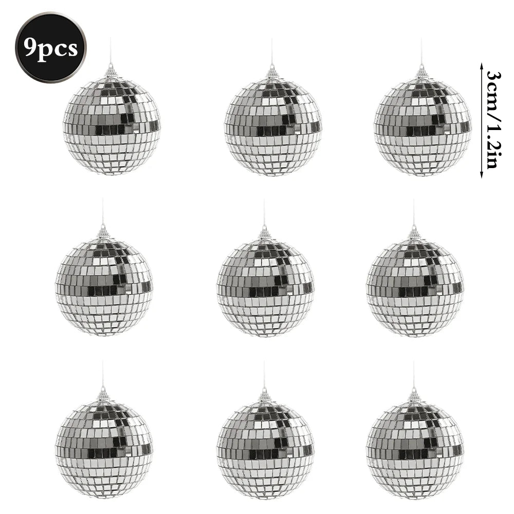 A set of nine silver mirror balls with hanging hooks.