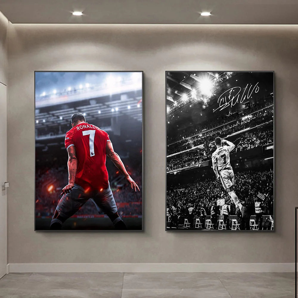 Two framed posters featuring Cristiano Ronaldo in a red jersey, displayed on a light gray wall.