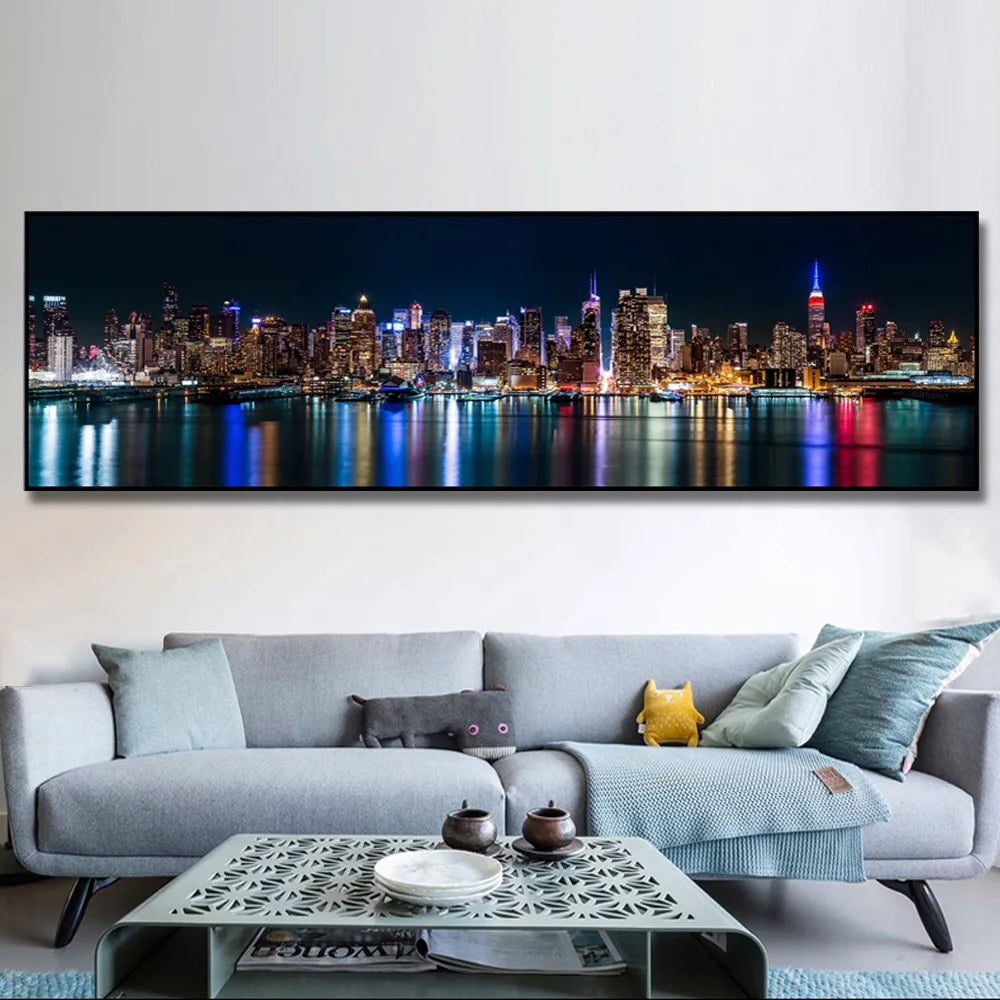 A canvas print depicting the New York City skyline at night with city lights reflecting on water.