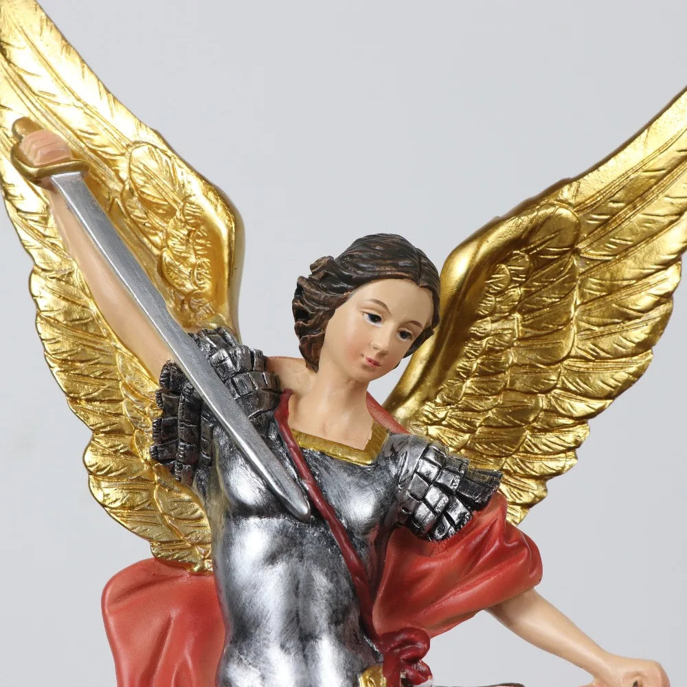 Resin statue of Saint Michael the Archangel with golden wings and a sword