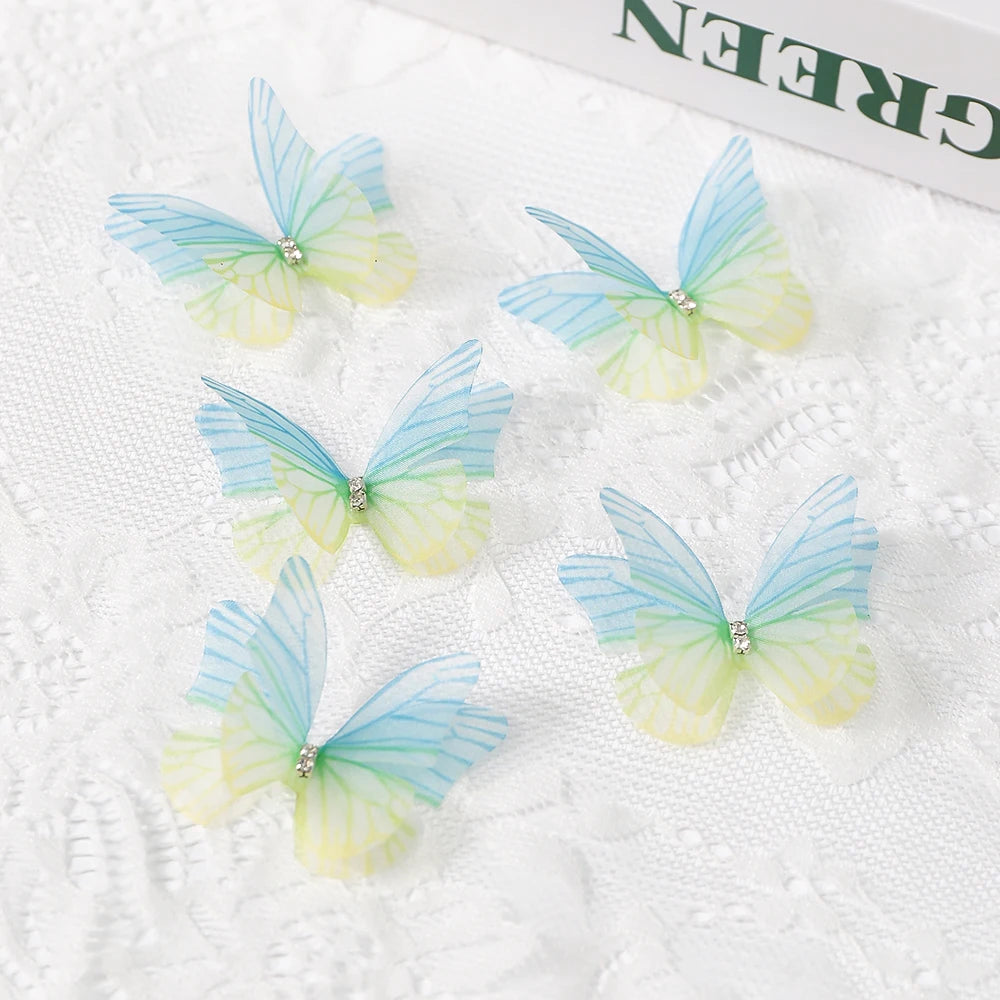 A collection of light blue and yellow 3D embroidered butterfly patches for crafts and decor.