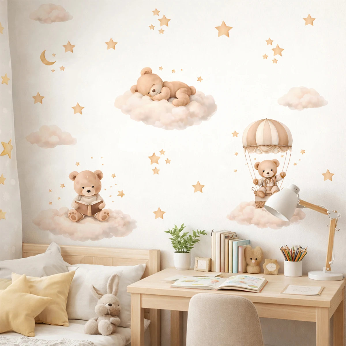 A wall decorated with cartoon bear, star, and cloud stickers for a kids room