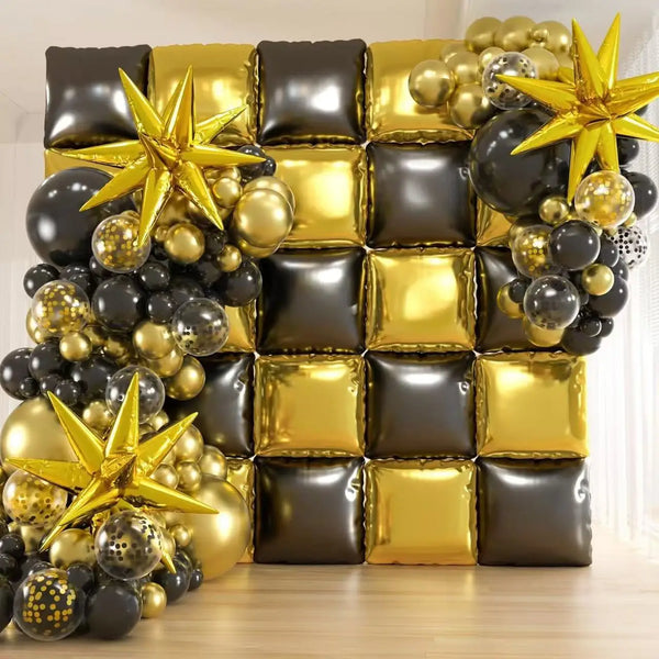 A wall display of black and gold foil balloons shaped into squares and stars for celebrations
