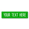 A green rectangular street sign with the text YOUR TEXT HERE on it.