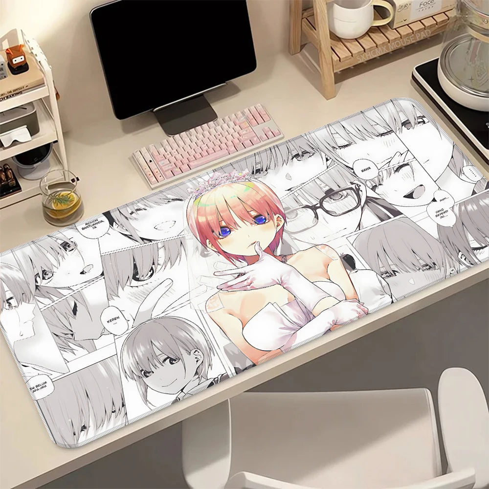 A desk mat featuring artwork of the Quintessential Quintuplets anime characters with a non-slip rubber base.