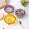 A set of natural crystal lotus bowls in purple and yellow colors for meditation and home decor