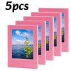 Five pink magnetic photo frames displayed in a row.